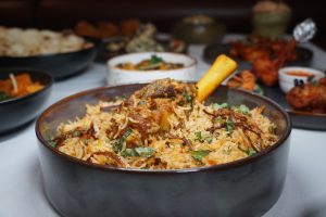 Flavorful chicken biryani garnished with herbs served at Panas Indian Dining in Twickenham